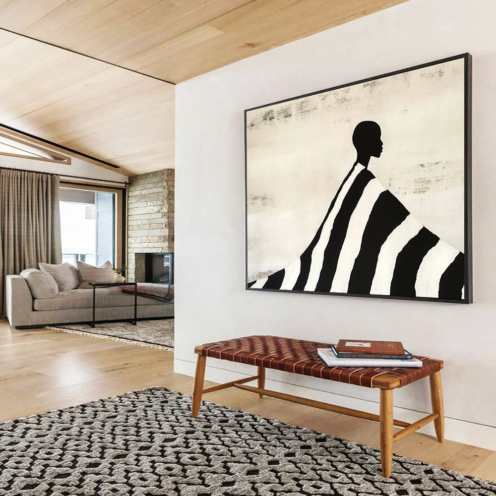 An abstract painting featuring a silhouette of an African man draped in a black and white striped blanket, evoking Tim Walker's artistic style.SC428