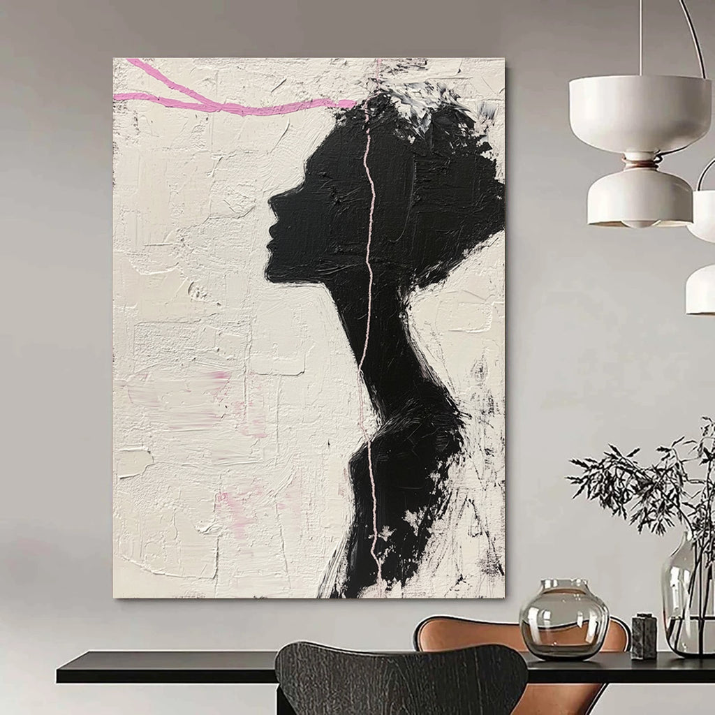 Large abstract painting in black and white featuring a woman’s silhouette with pink accents enhancing her facial features against a textured background.STSC1091