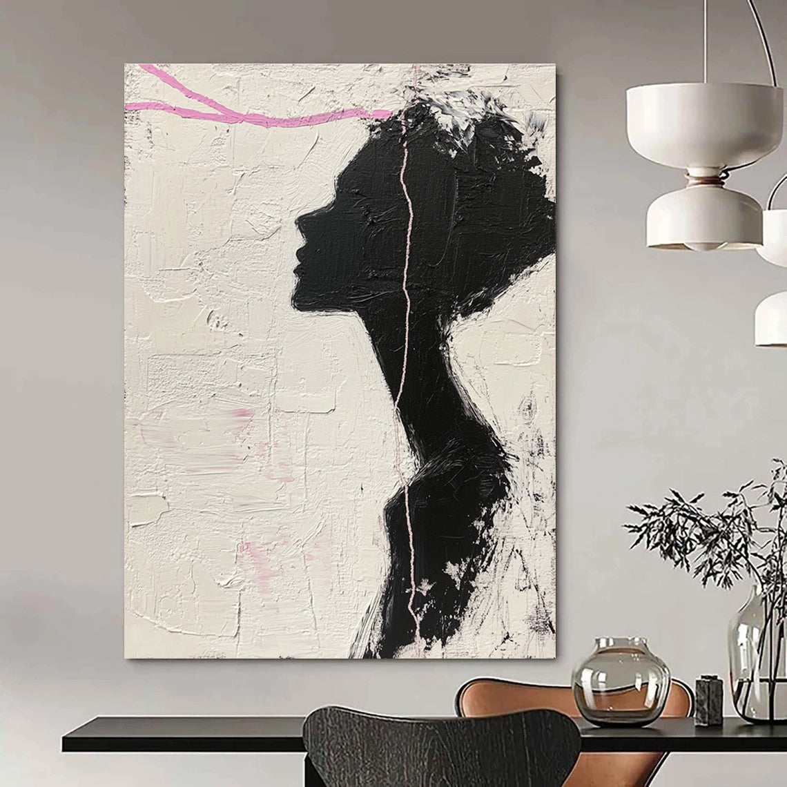 Large abstract painting in black and white featuring a woman’s silhouette with pink accents enhancing her facial features against a textured background.STSC1091