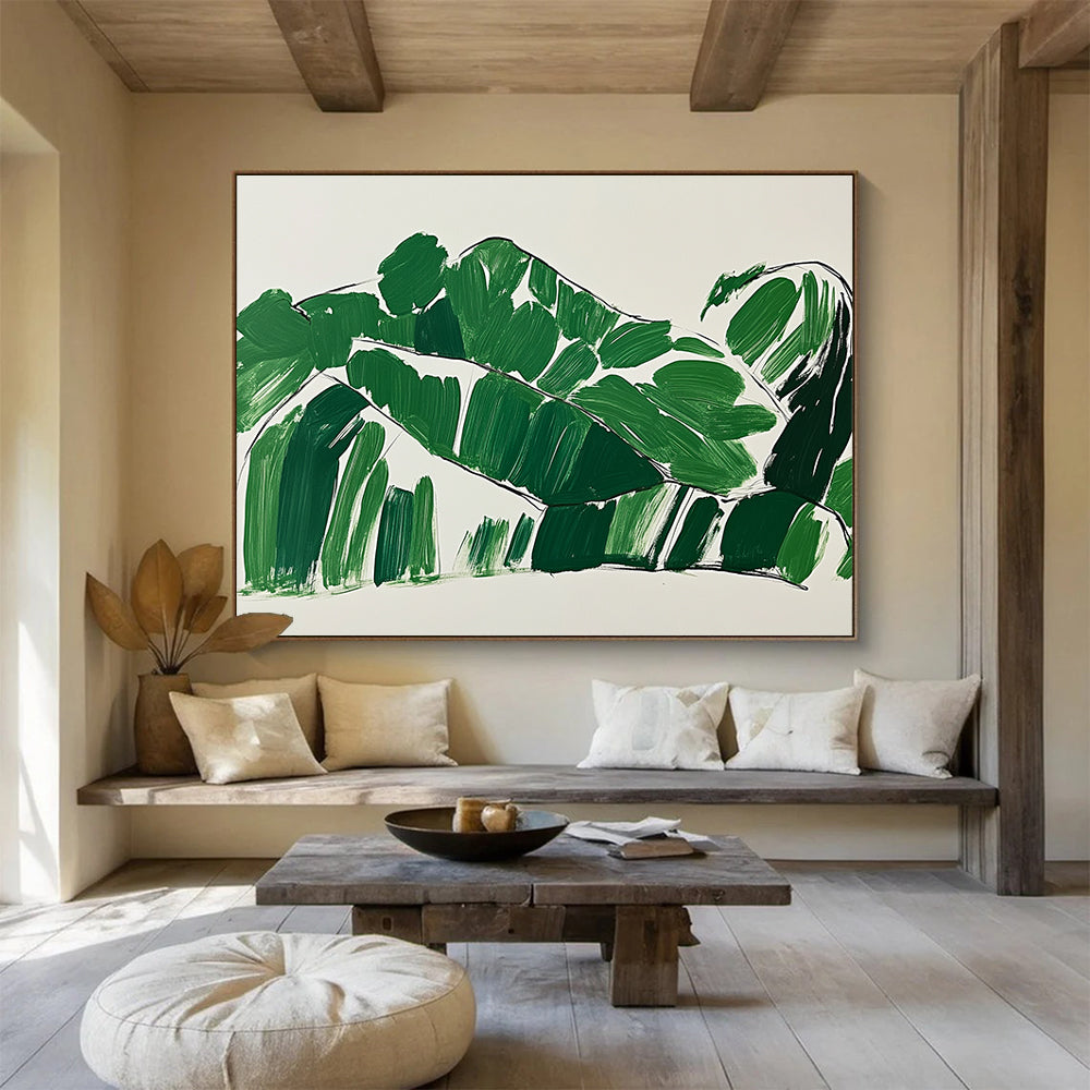 A large abstract painting featuring green leaves in the shape of a woman lounging on a couch with minimalist brush strokes on a white background.SC551