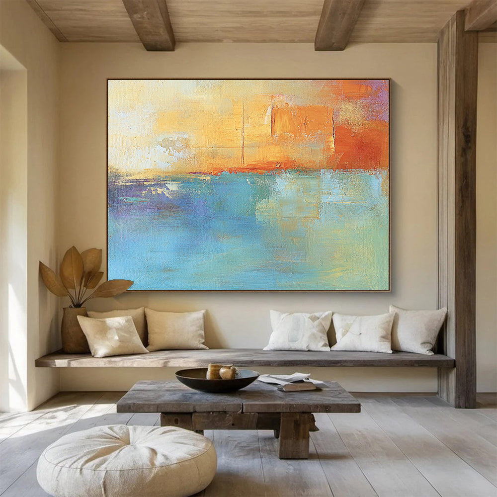 Large abstract oil painting in muted orange and aqua with soft shapes and blurred edges evoking calmness and tranquility through its impressionist style.SC124