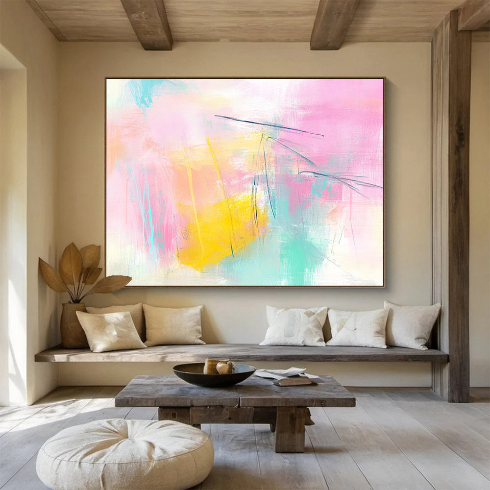 Large abstract painting featuring pink and yellow tones light blue lines and soft shapes creating a dreamy atmosphere with delicate brushstrokes and pastel background.SC211