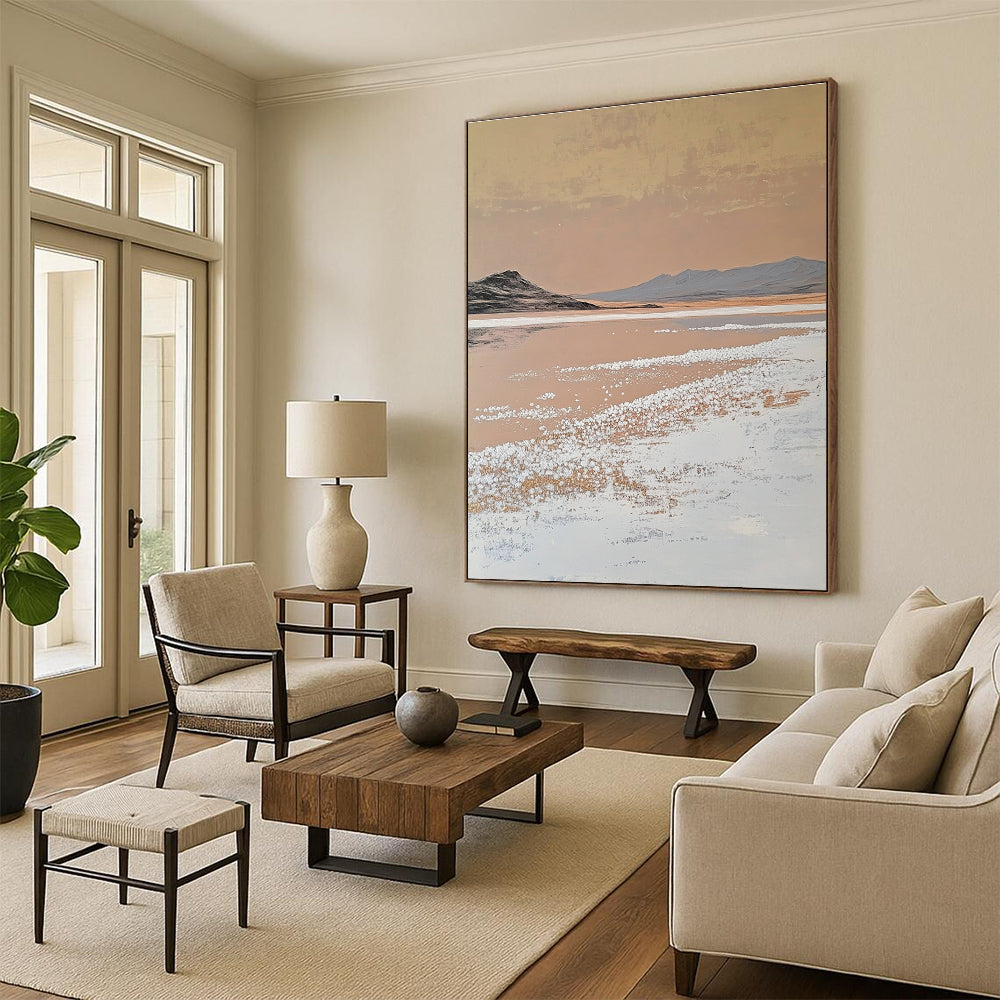 A large abstract painting features white salt crystals on a lake contrasting with textured brushstrokes in light beige and dark gold against a minimalist landscape.STSC1435