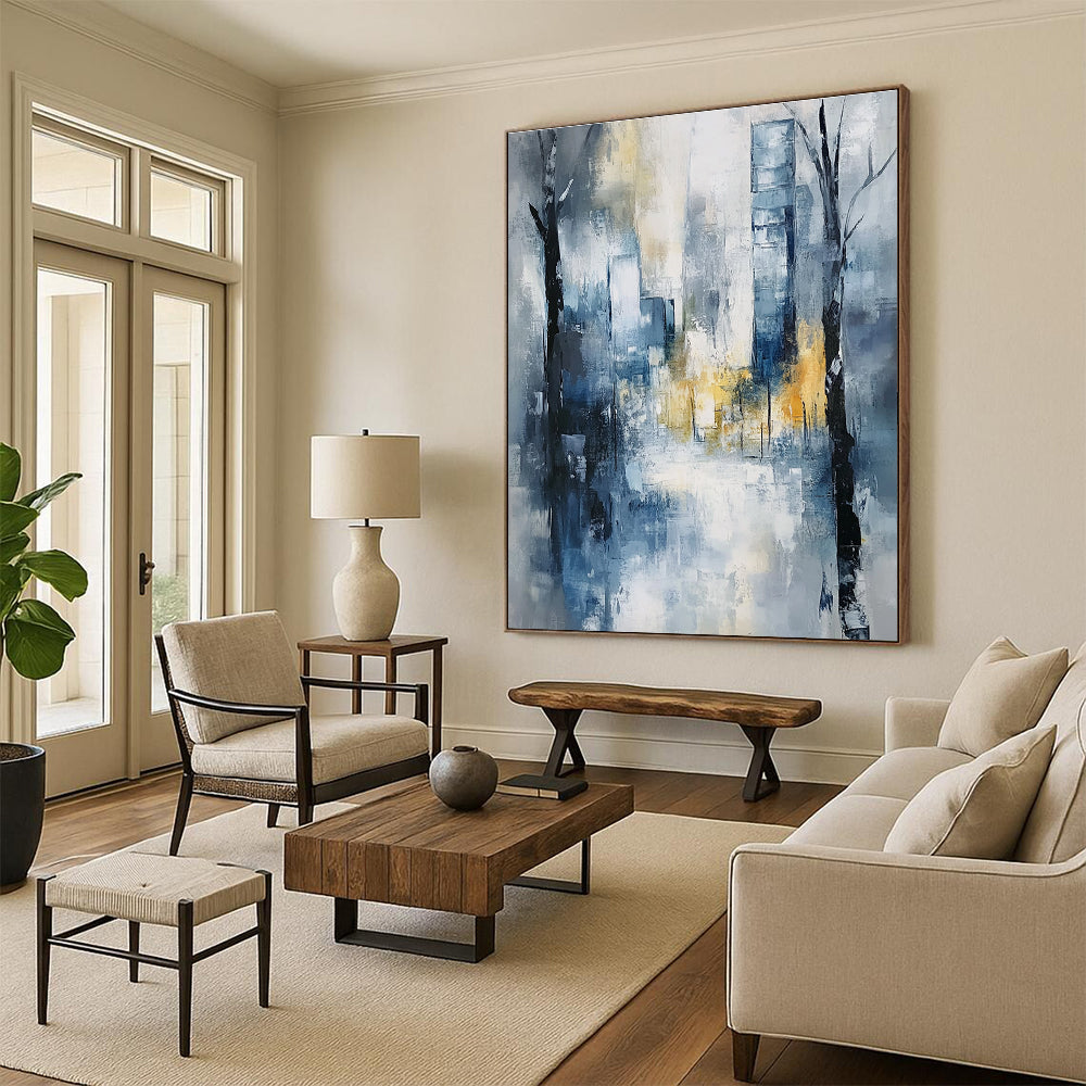 Large abstract painting of an urban cityscape in soft blue and grey tones with hints of yellow and white, featuring expressionist elements and a serene mood.STSC278