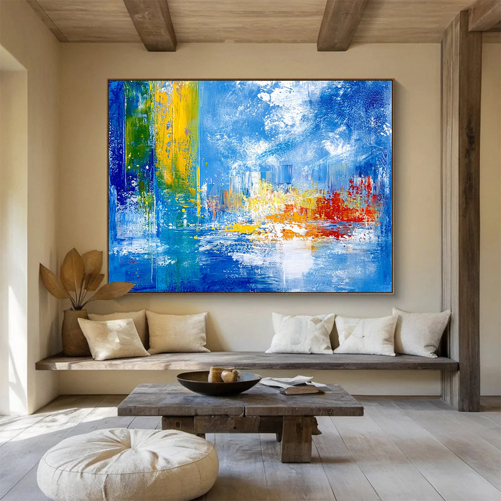 Bold abstract painting with vibrant teal yellow and red colors depicting an underwater city under sea ice against a blue sky and cloud backdrop.SC028