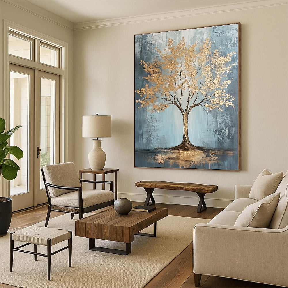 Large abstract painting with gold leaf accents on grey and light blue textured canvas featuring dynamic brush strokes and warm lighting, embodying sophisticated bohemian style.STSC493