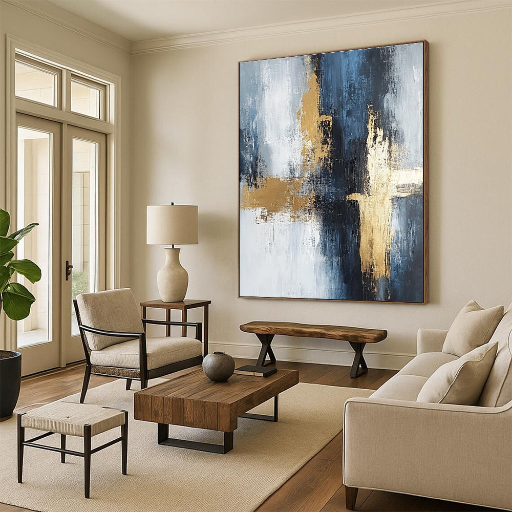 Large abstract painting in light gray and dark blue tones with gold accents featuring strong brushstrokes and delicate textures creating spatial depth.STSC433