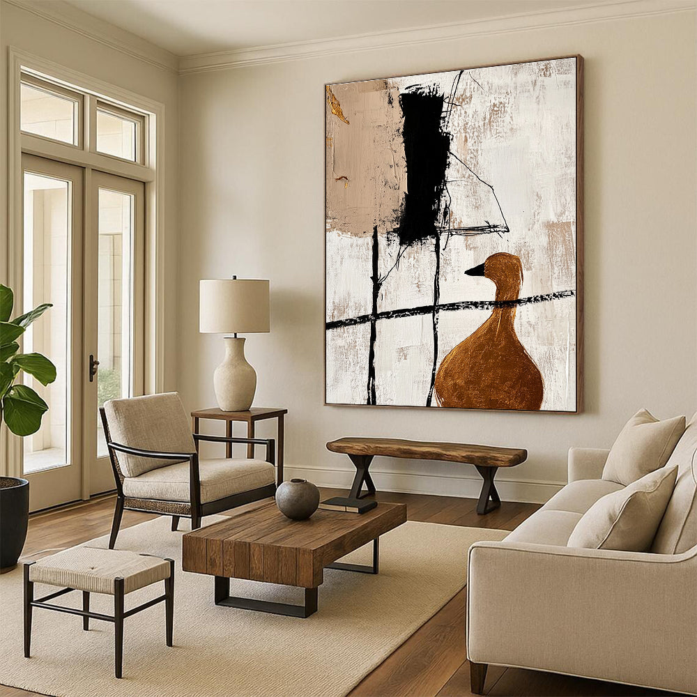 Large abstract painting featuring minimalist black lines and gold foil accents with a close-up of a golden goose in a beige color scheme.STSC466