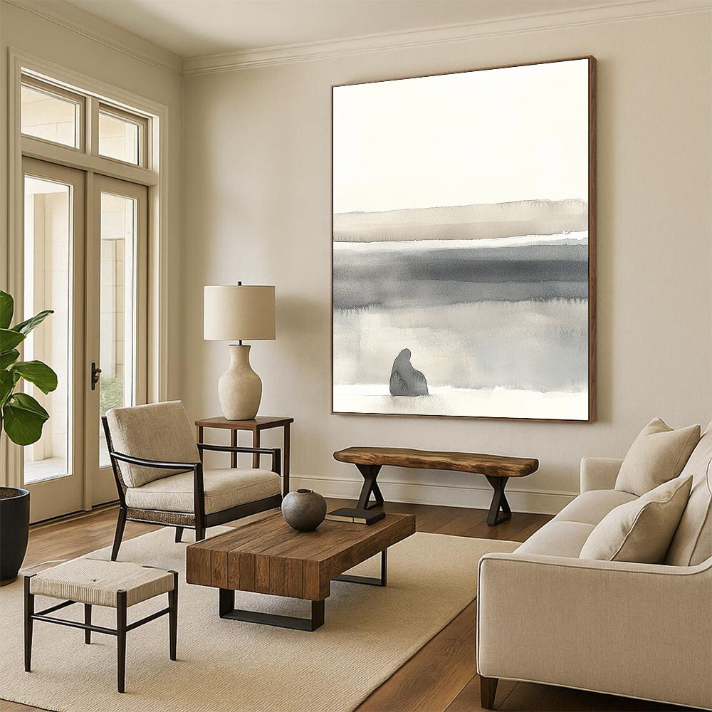 Large abstract painting in soft whites and grays featuring minimalistic landscape with organic shapes and muted tones for a serene atmosphere.STSC1465