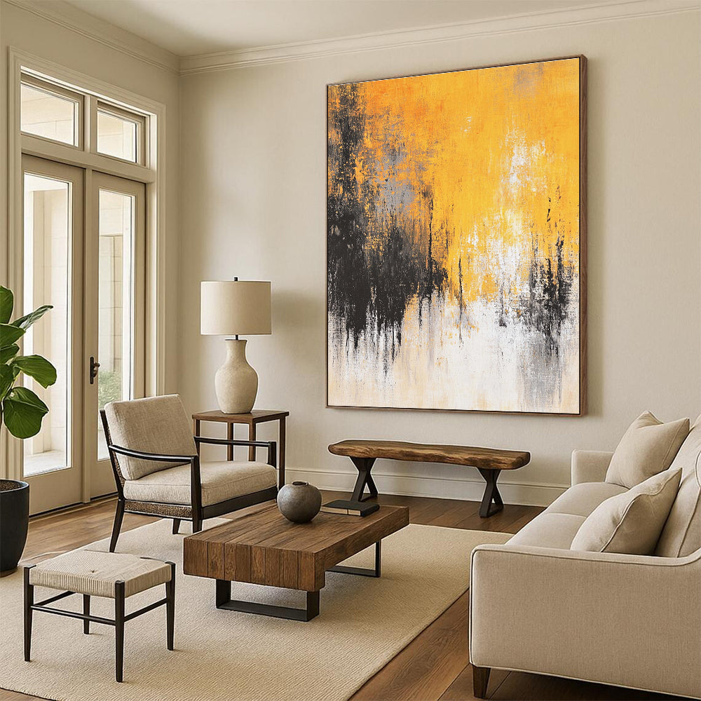 Large abstract painting featuring faded textures and dreamy shades of mustard yellow grey white and black depicting distant trees and a flowing river.STSC728