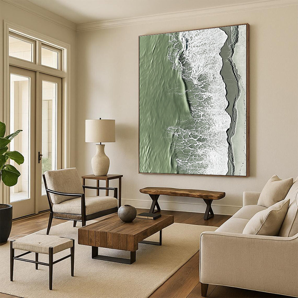 A large abstract painting capturing the serene edge where sand meets water in green and grey tones with rolling waves.STSC1158