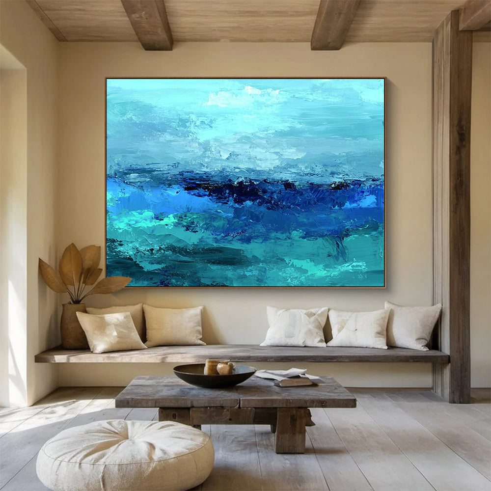 Large abstract ocean artwork in shades of aqua teal and navy with textured layers suggesting waves evokes tranquility and depth on canvas.SC035