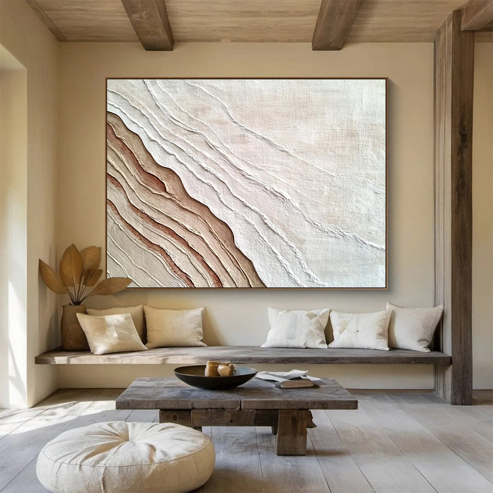 An abstract painting featuring the interplay of sand and water in white and brown hues, symbolizing growth and change through rich textures.SC448