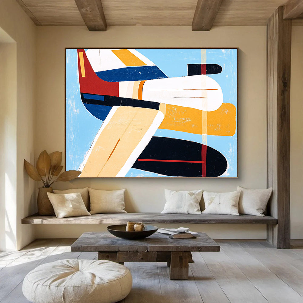 Large abstract painting of an airplane with bold lines and vibrant colors including blue, red, yellow, and orange in the style of Mary Blair.SC040