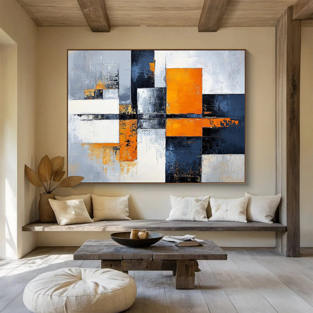 Large abstract painting featuring gray, white, and orange color blocks with a calming cityscape background, offering a sense of harmony and balance.SC100