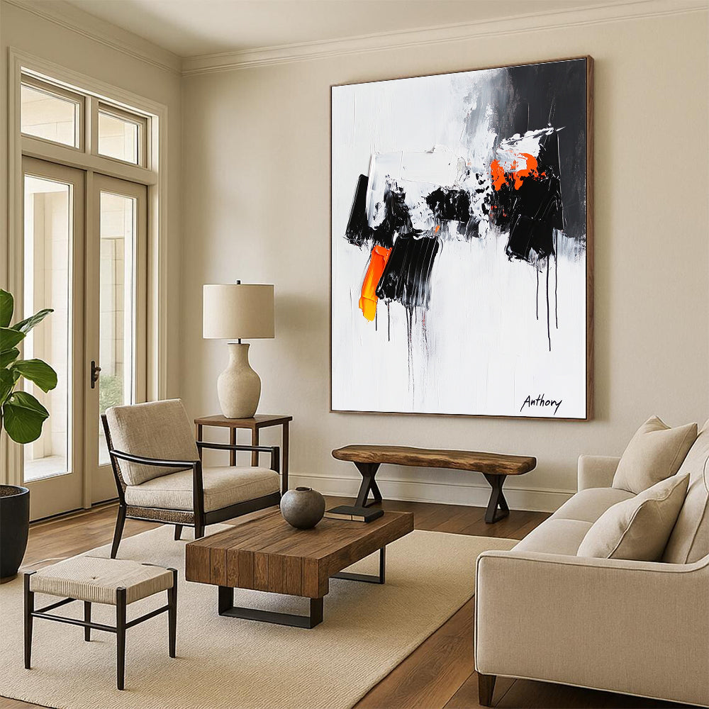 Large abstract painting featuring the word Anthony with black and orange dripping paint thick brush strokes and bold black shapes on a white background.STSC350