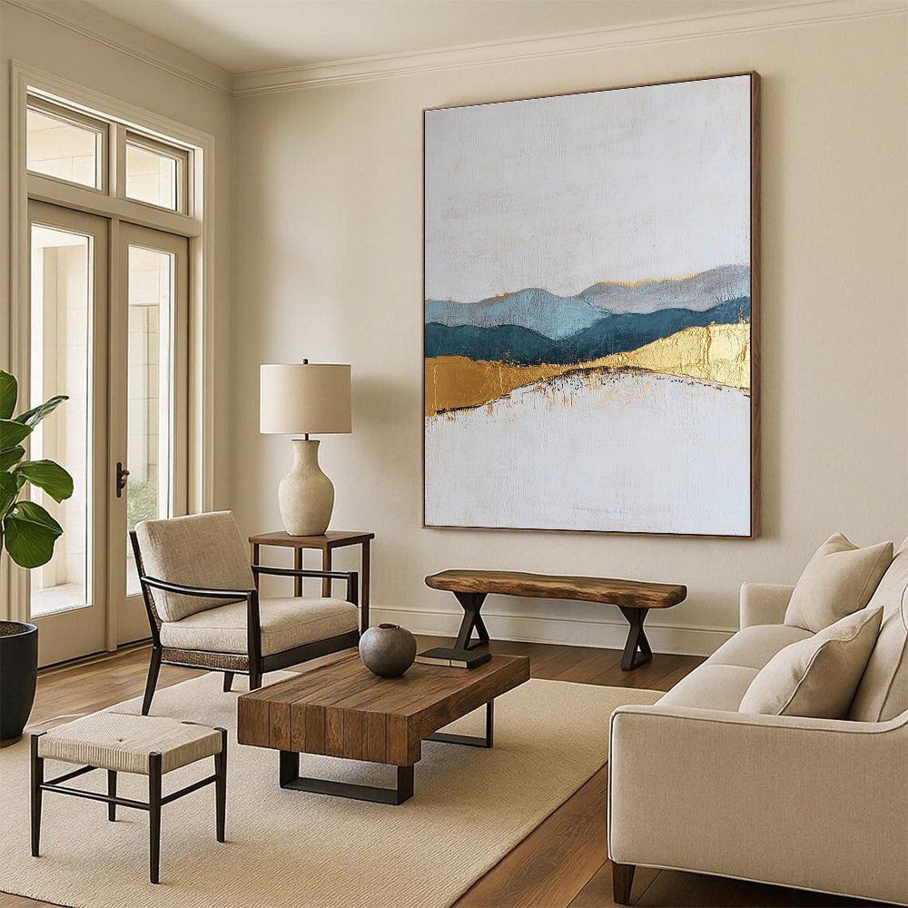 Large abstract painting featuring textured layers in neutral colors with elegant gold and blue accents for a sophisticated decor.STSC110