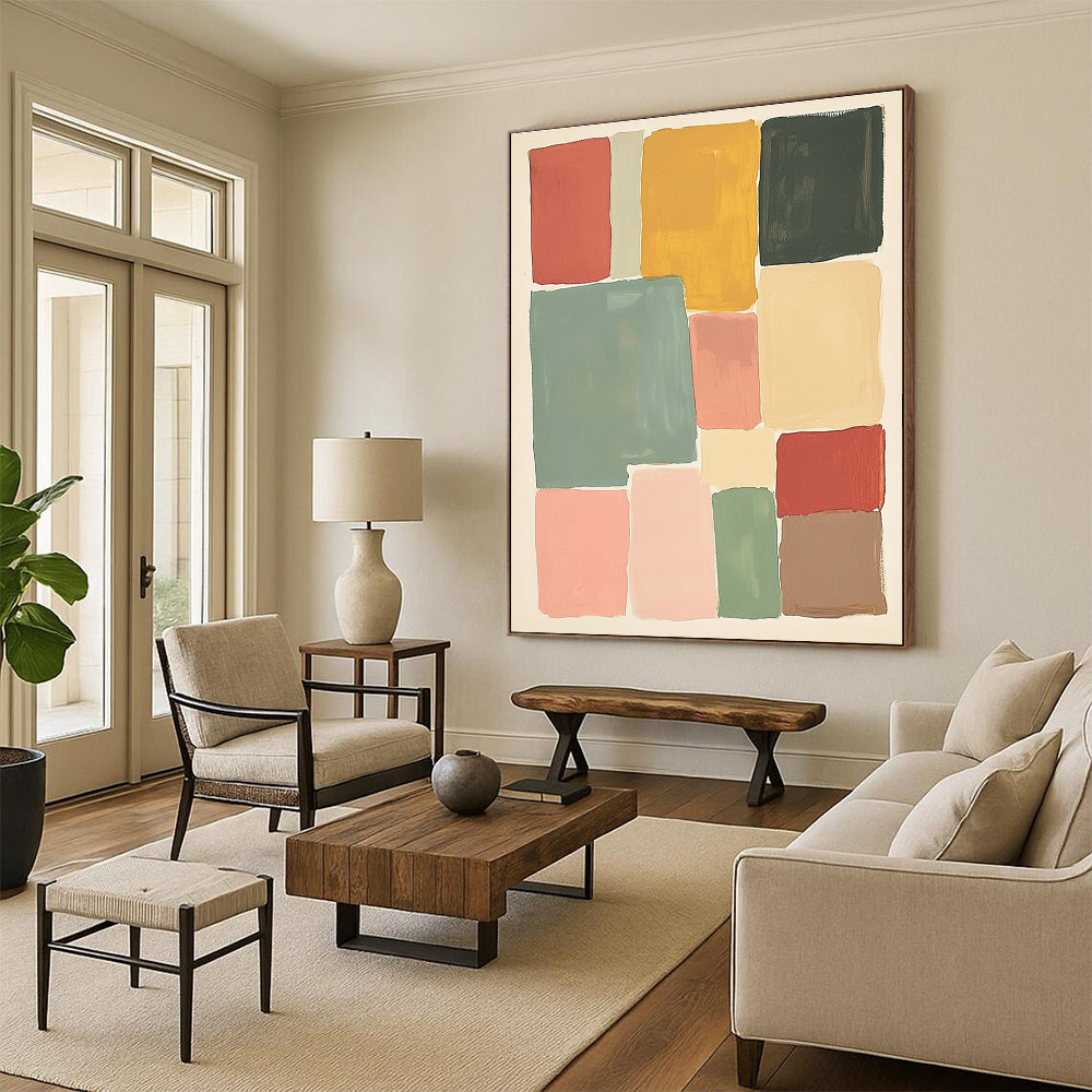Large abstract painting featuring muted colors and soft hues in thick block shapes of sage green pink red and yellow against a white background.STSC1361