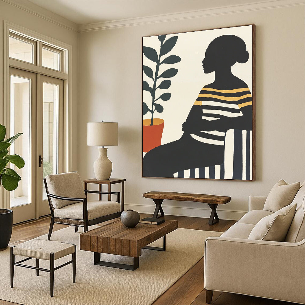 Large abstract painting featuring an African woman on a striped sofa with silhouettes and vibrant colors complemented by a pot of green leaves.STSC537