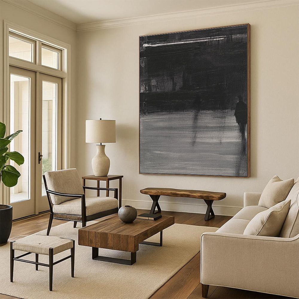 Large abstract painting featuring deep gray tones bold brushstrokes and a mysterious atmosphere with soft lighting and striking light shadow contrasts.STSC910