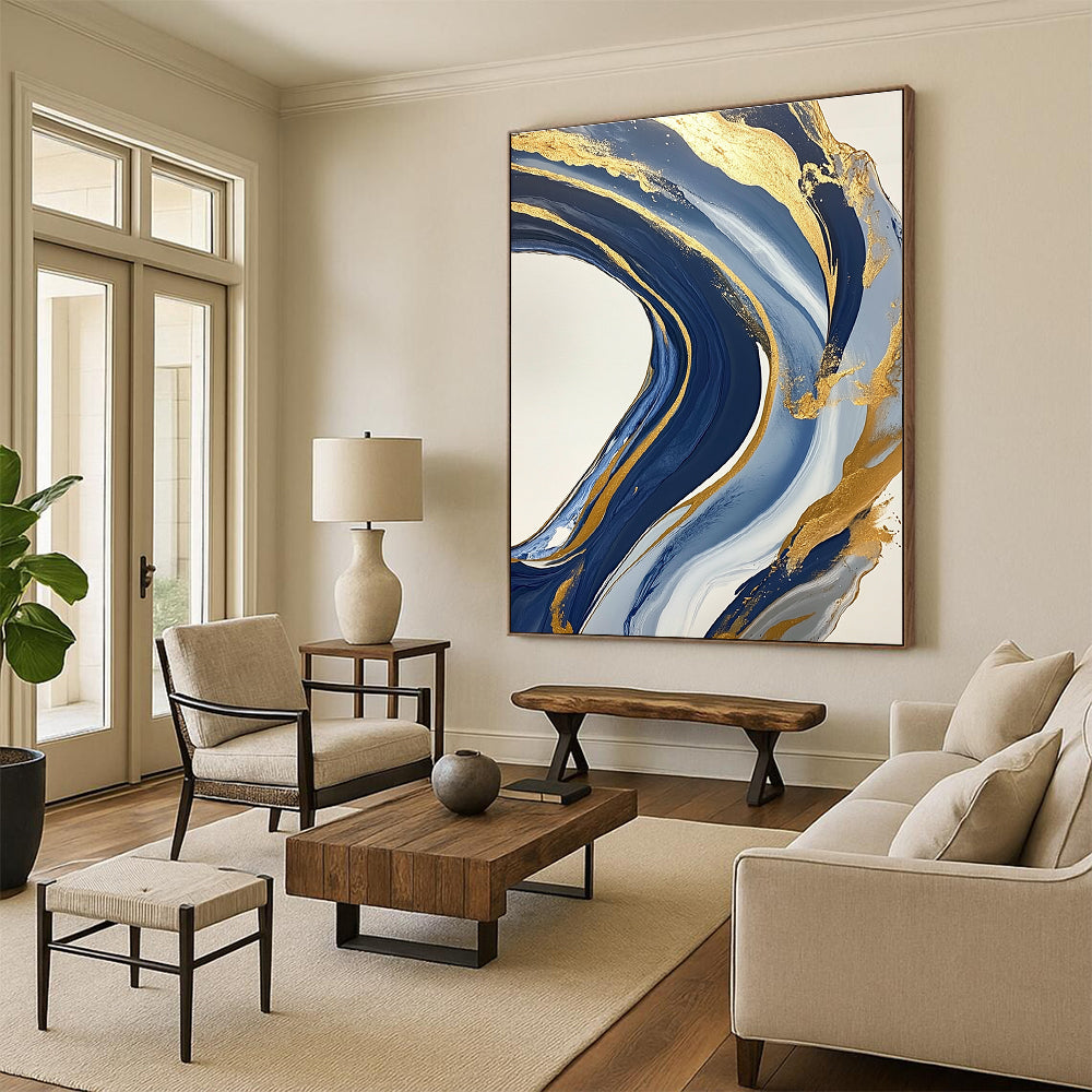Large abstract blue and gold painting featuring marbling on a white background with swirling gold lines and fluid shapes creating luxurious textures.STSC032