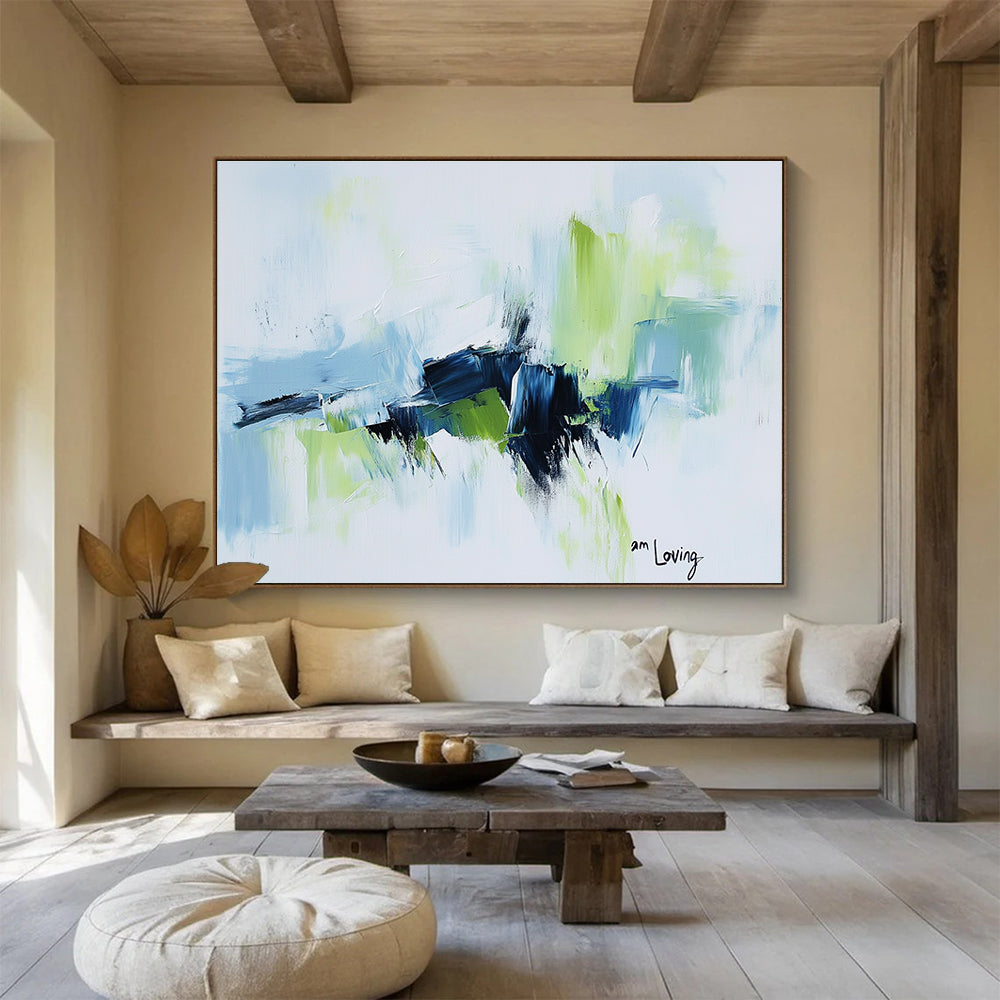 Abstract painting with a white background highlighted by light blue and green accents features expressive brush strokes and the words am loving.SC214