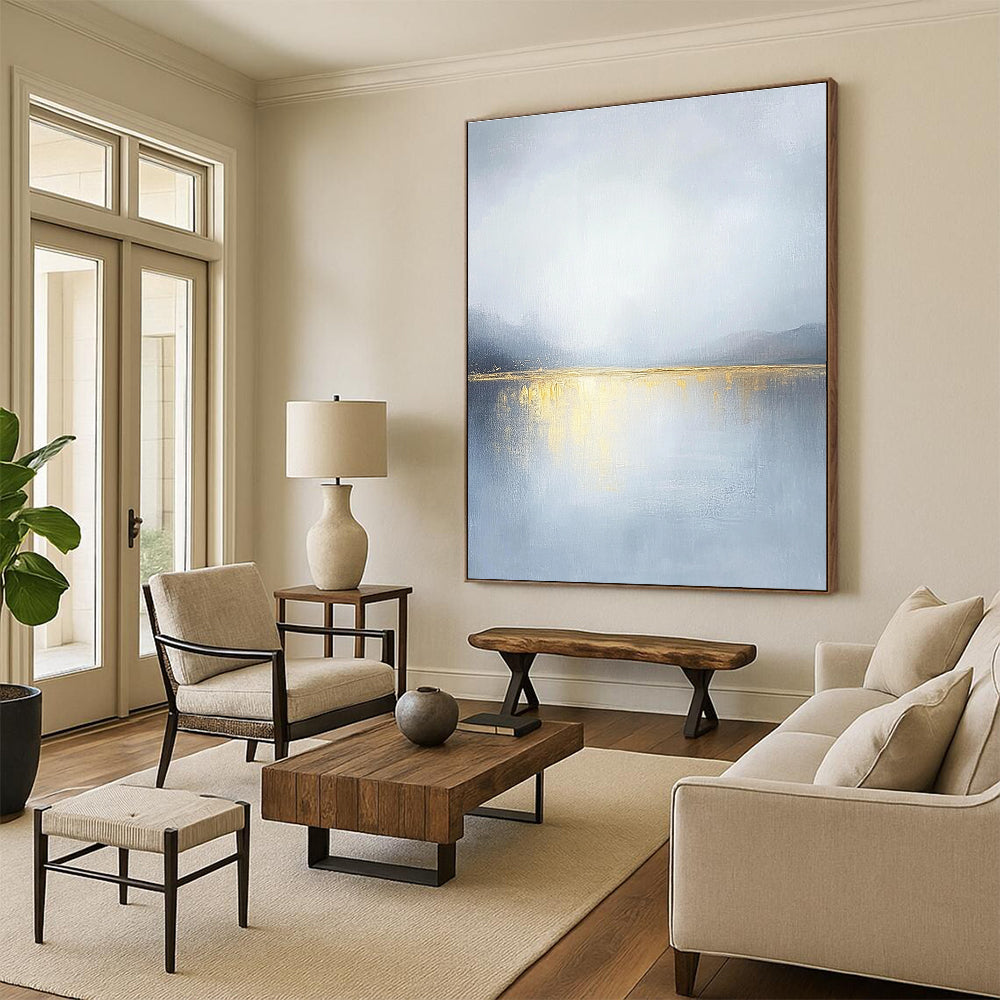 Large abstract painting of an overcast sky with golden water reflections soft tones and serene landscape capturing a tranquil mood.STSC271