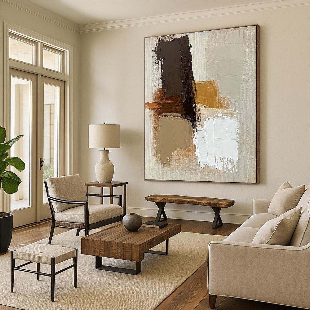 Large abstract painting with brown beige and white colors featuring thick brush strokes and simple shapes on a neutral beige background.STSC747
