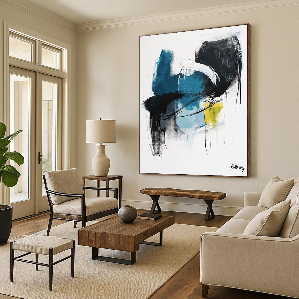 Large abstract painting in blue black and white tones with yellow accent by Anthony evoking calmness and serenity through soft brush strokes and thick lines.STSC1068