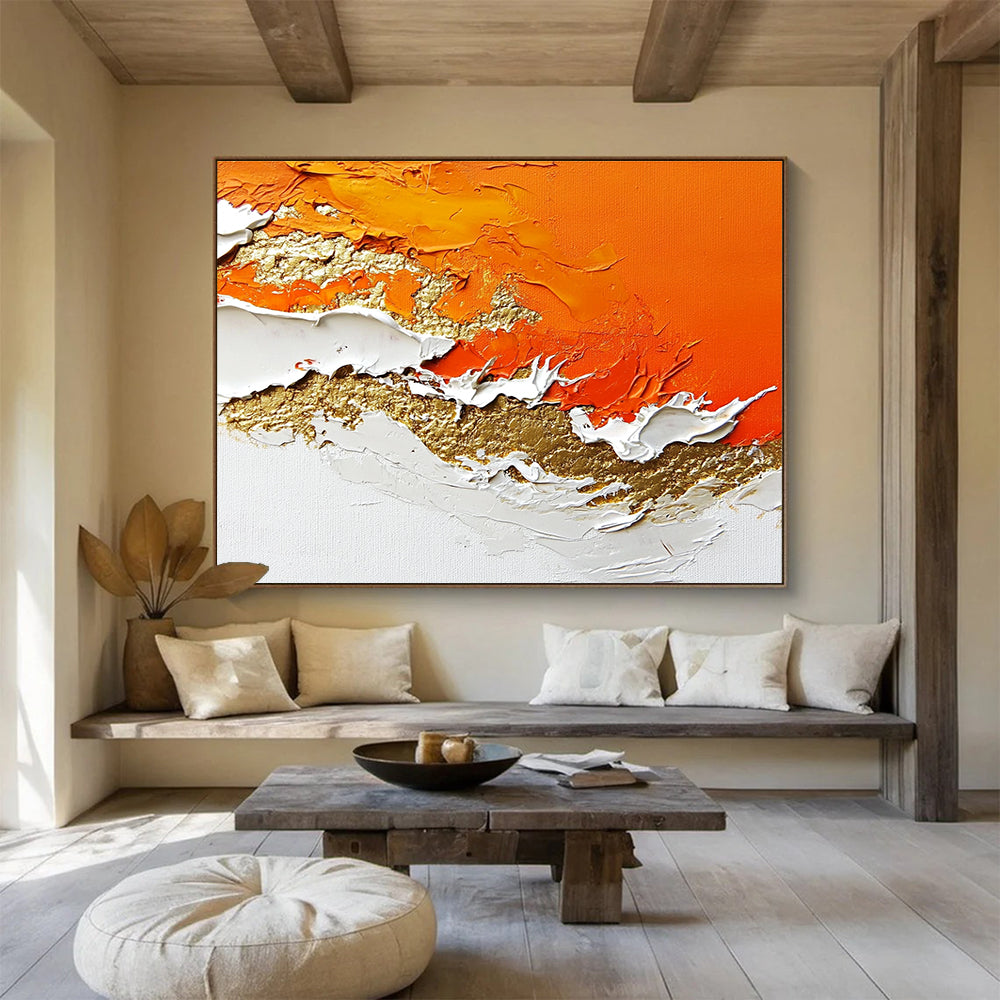 A large abstract painting with layers of orange and white enhanced by gold details and rich texture.SC325