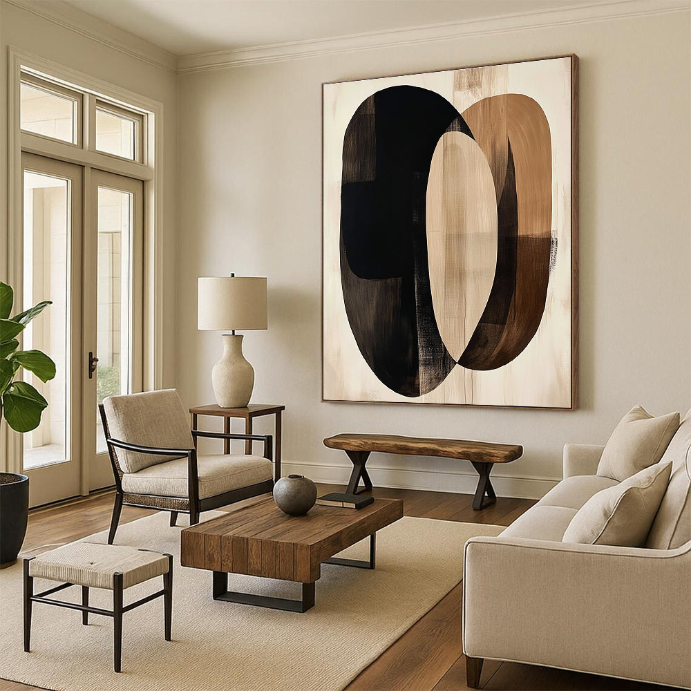 Large abstract artwork featuring fluid beige and black shapes with dark brown ovals on a cream background evokes tranquility through minimalist design.STSC470