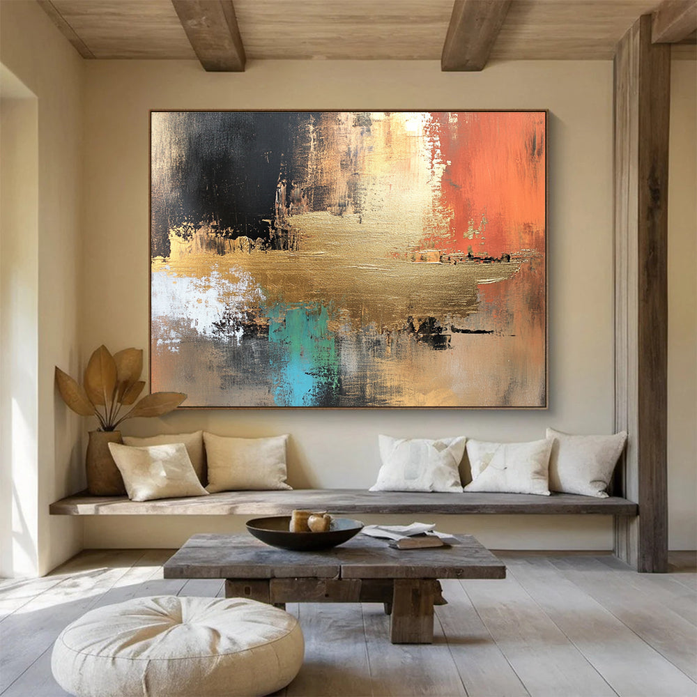 Large abstract canvas painting in golden copper and brown tones with vibrant blue green red black accents featuring white elements and light gold foil details.SC091