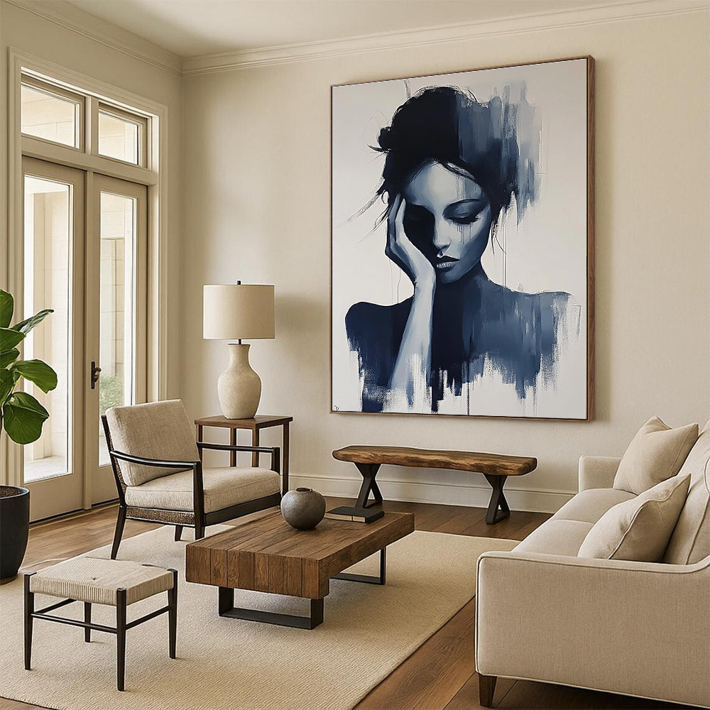 Large abstract painting of a gray woman with her hand on her face and hair up in black and white colors.STSC1378