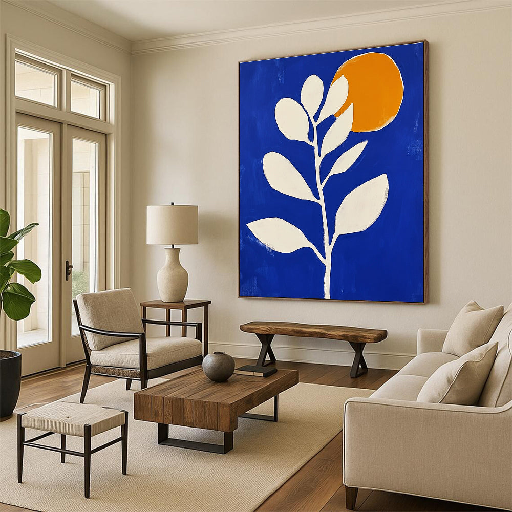 Large abstract painting in blue and white featuring minimalist flower shapes and an orange sun with bold brush strokes.STSC920