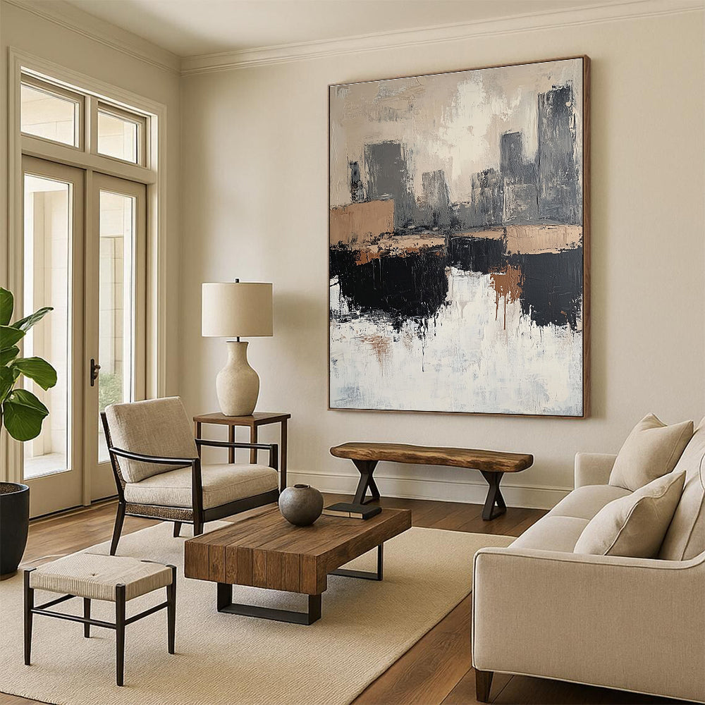 Large abstract painting featuring beige and white tones with gray and brown accents depicting rocks and a cityscape in a minimalist style.STSC412