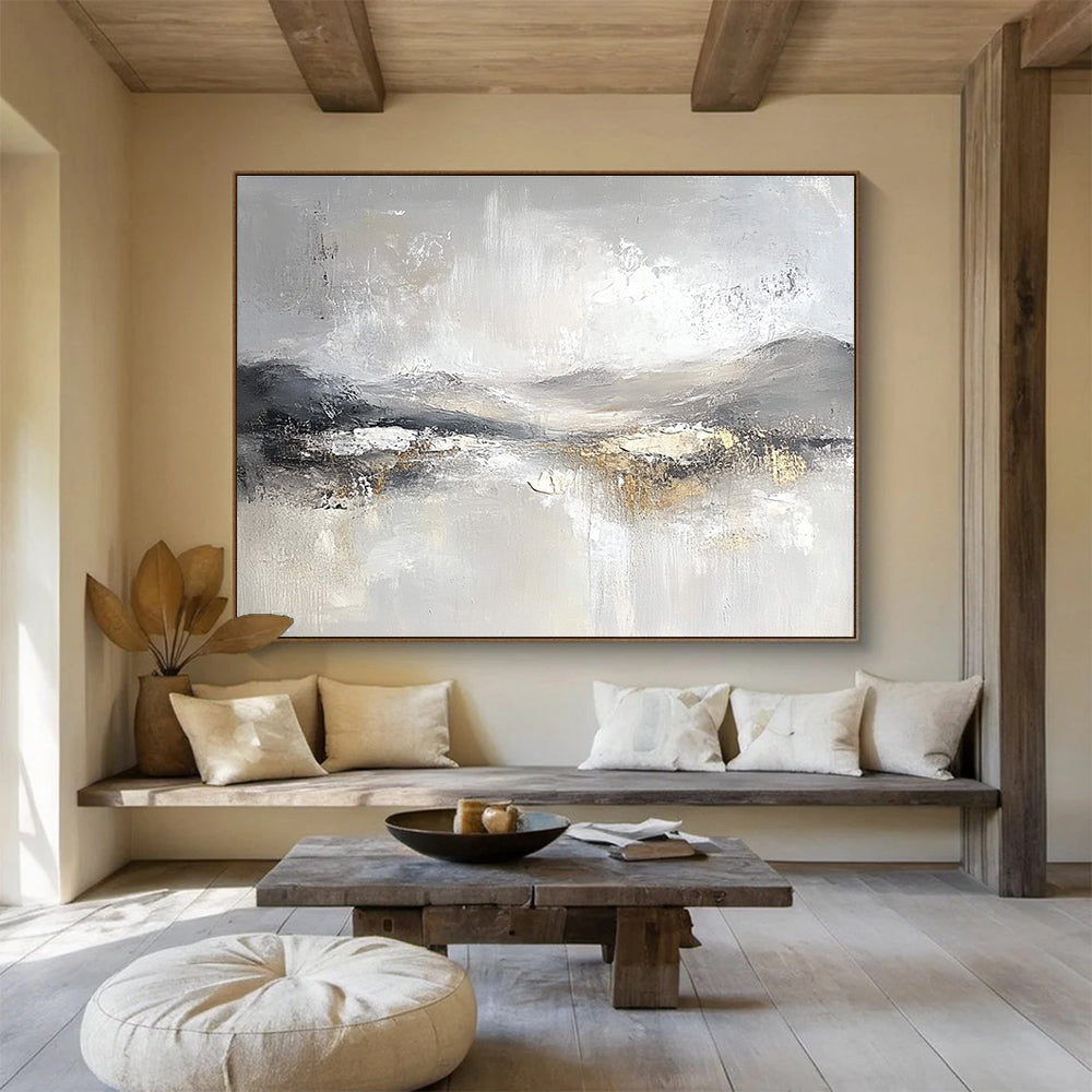 Large abstract painting featuring soft gray and white tones with subtle textures of snow-covered hills and ethereal clouds for a calming atmosphere.SC083
