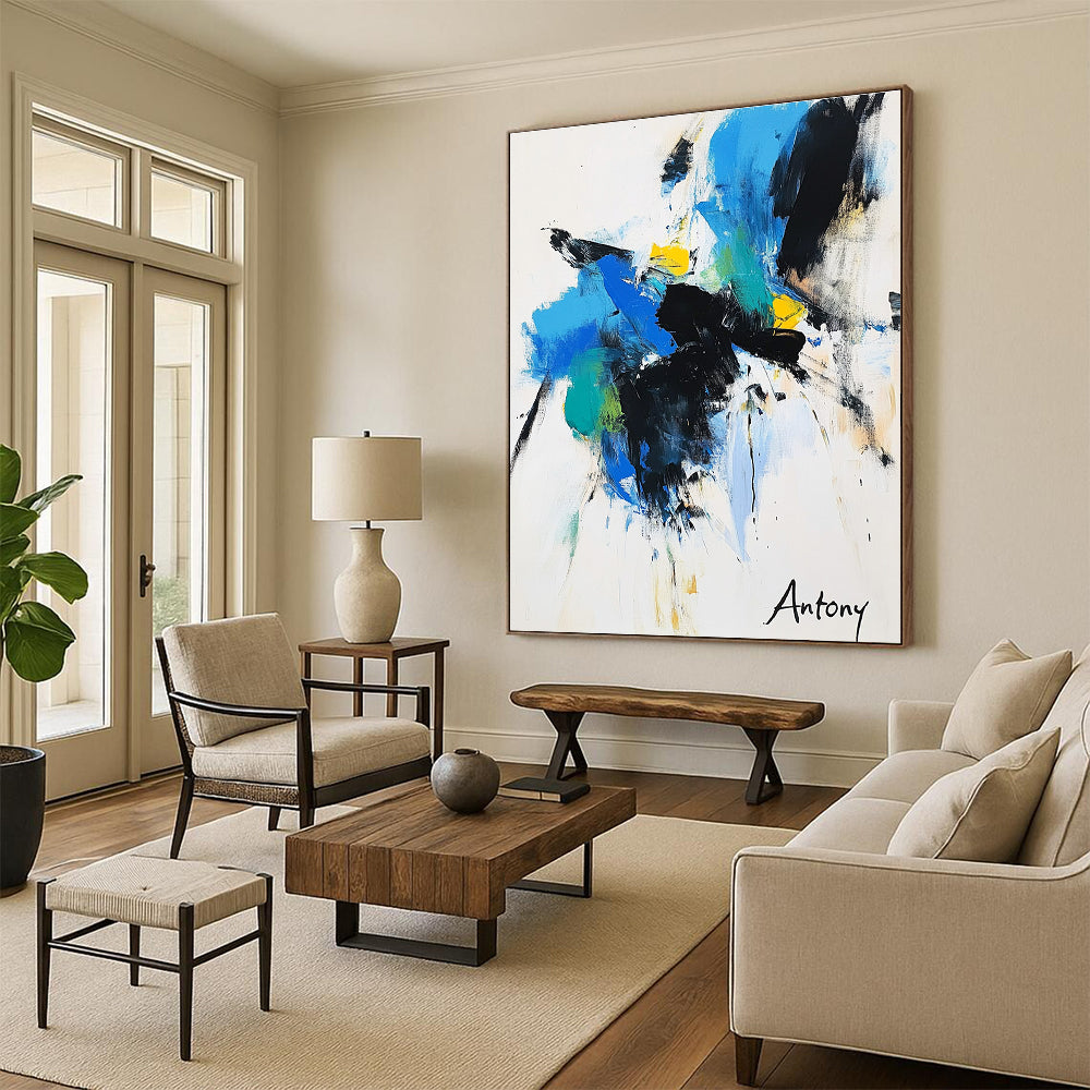 Abstract painting features bold black brush strokes with blue green and yellow accents on a white background with Antony elegantly displayed in large letters.STSC039