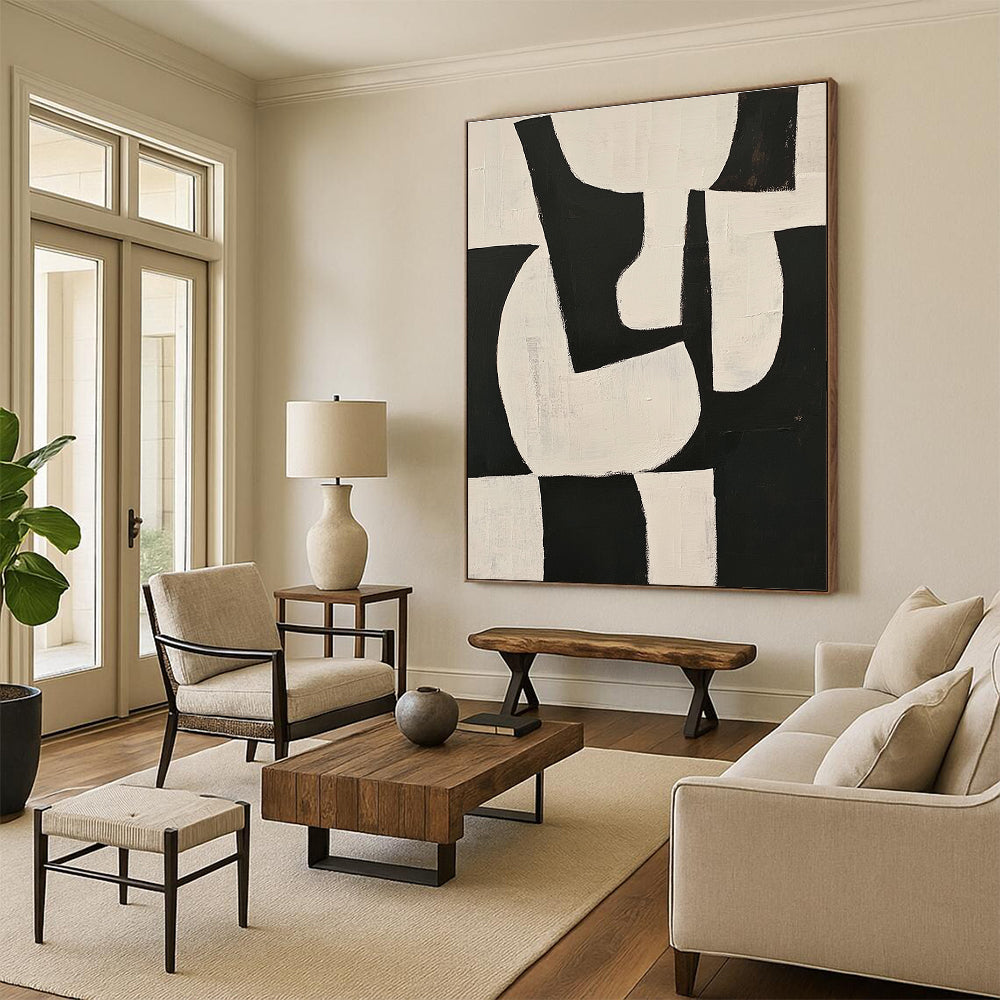 Large abstract painting featuring black and white shapes on a beige background with organic forms and overlapping lines for depth and elegance.STSC329