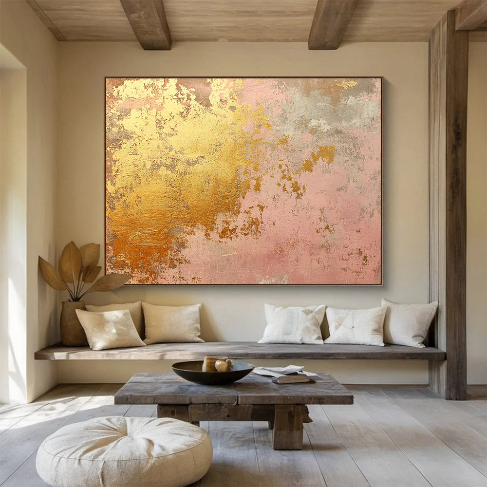 A large abstract canvas in soft pink and gold tones evokes rustic charm with weathered texture and hints of rust, ideal for home decor.SC480