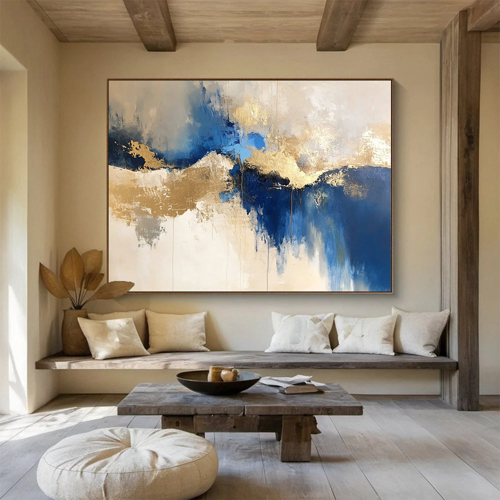 Large abstract blue and gold painting on a white background with elegant beige tones, ideal for modern decor and artistic spaces.SC022