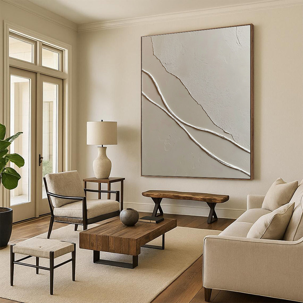 A large abstract painting featuring smooth white wavy lines against textured light-colored plaster walls enhancing depth in a minimal space.STSC941