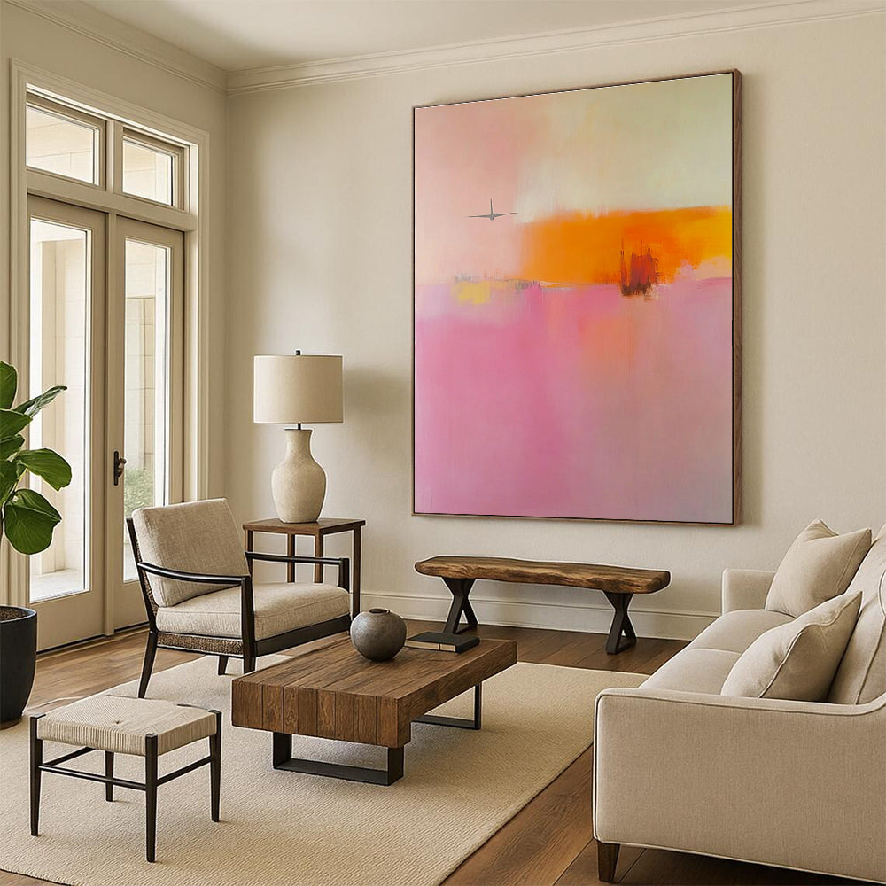 Large abstract painting in soft pink orange and yellow tones featuring blurred edges and an airplane shape in a minimalist style.STSC789