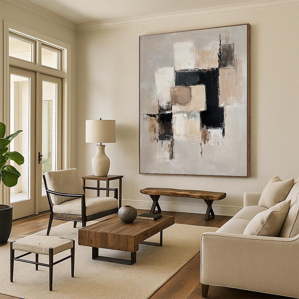 Large abstract painting with beige and white blocks black accents and soft edges on a light gray background creating an elegant minimalist feel.STSC220
