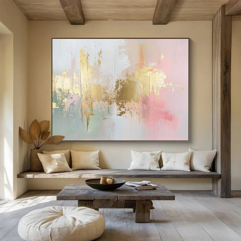 Large abstract painting in soft pink, white, and gold with hints of light green and neutral tones, featuring dynamic brush strokes and a modern art style.SC283