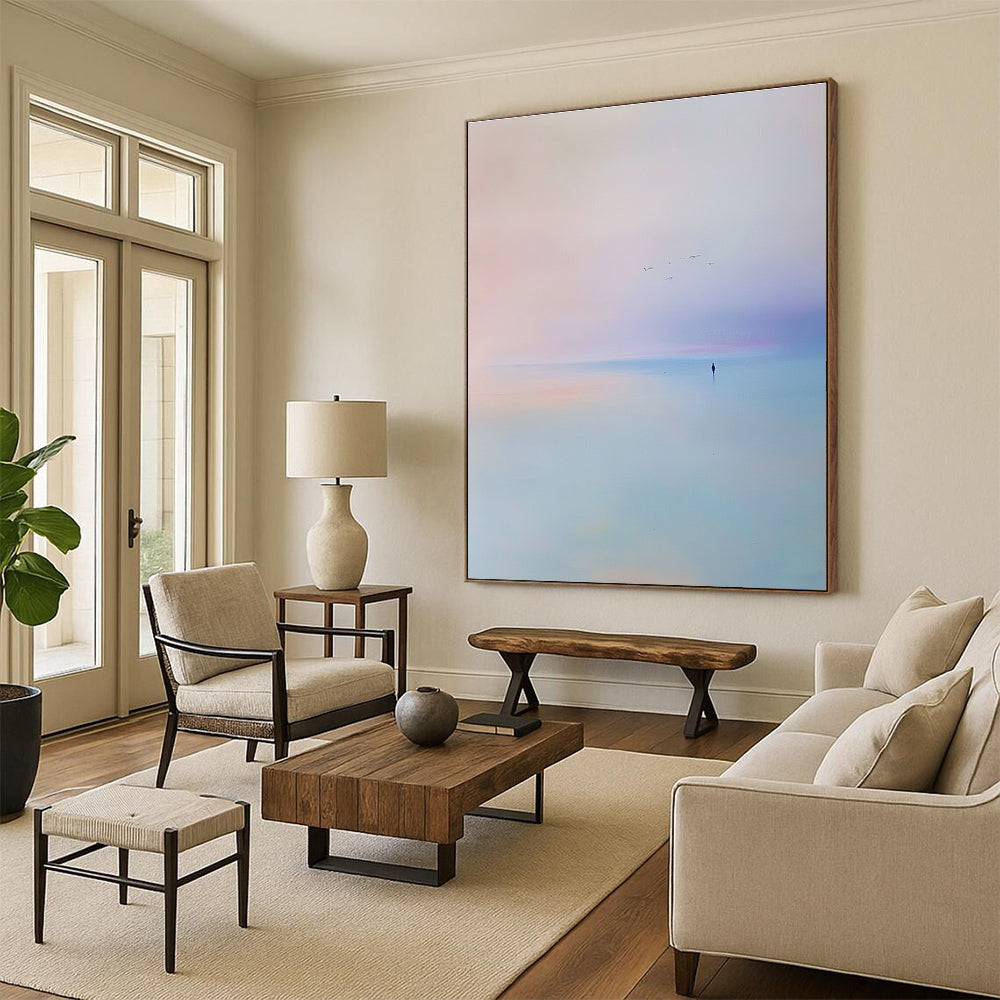Abstract painting of the sea featuring a light blue and purple sky with soft tones and minimalist style capturing a serene beach scene with flying birds.STSC346