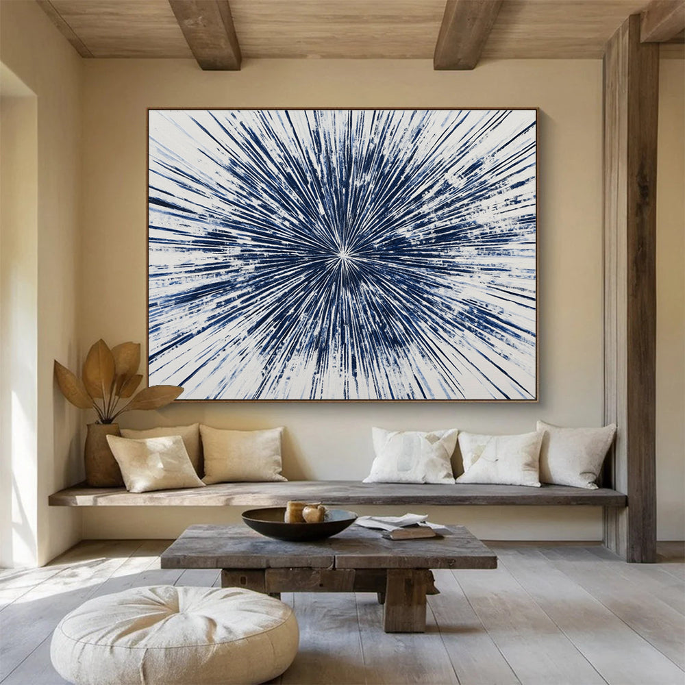 Large abstract painting featuring a blue starburst design with intricate radiating lines, creating a vibrant and energetic composition on a white background.SC430