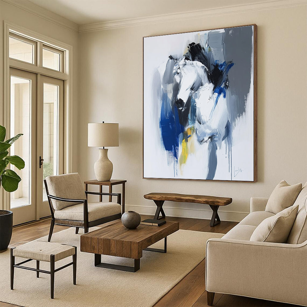 Large abstract painting in blue and white with dynamic brushstrokes reveals movement and emotion featuring elements of strength and energy.STSC036