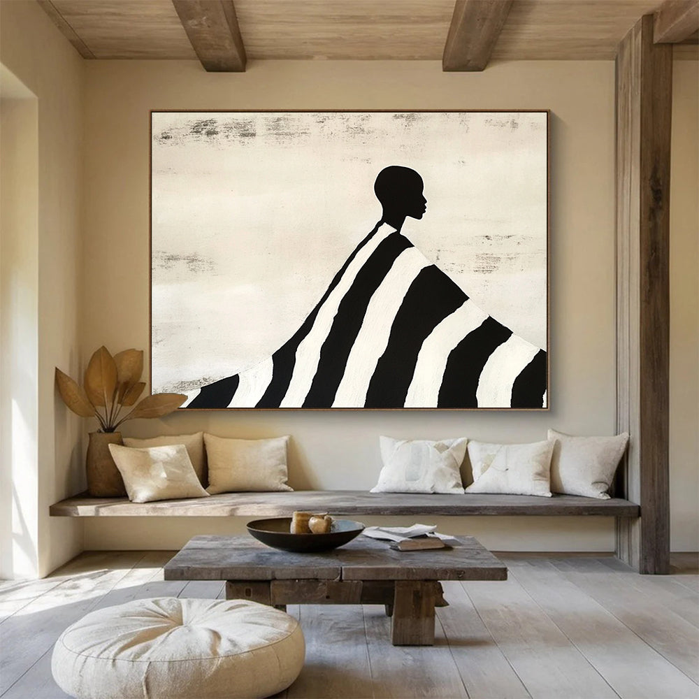 An abstract painting featuring a silhouette of an African man draped in a black and white striped blanket, evoking Tim Walker's artistic style.SC428