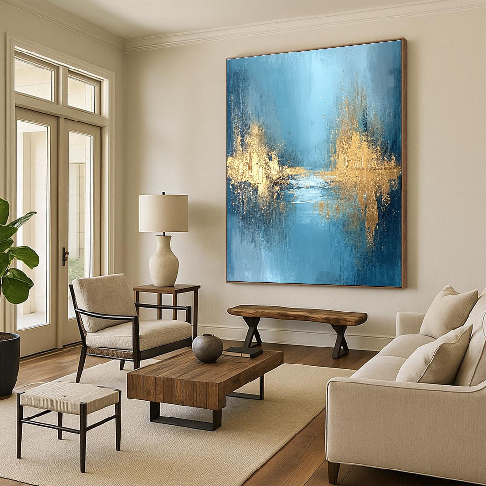 Large abstract painting featuring textured golden water and a misty morning atmosphere with blue grey and white hues for a serene mood.STSC723
