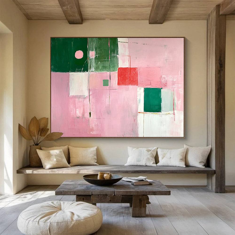 A large abstract painting featuring soft pink and green shapes creates a calming atmosphere with an inviting glow and an empty center.SC538